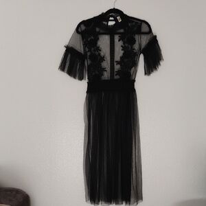 Elegant Black Midi Dress with Floral Appliqué